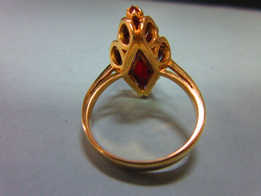 A modern red hardstone ring, the four diaper step cut deep crimson red stones, believed to be - Image 4 of 4