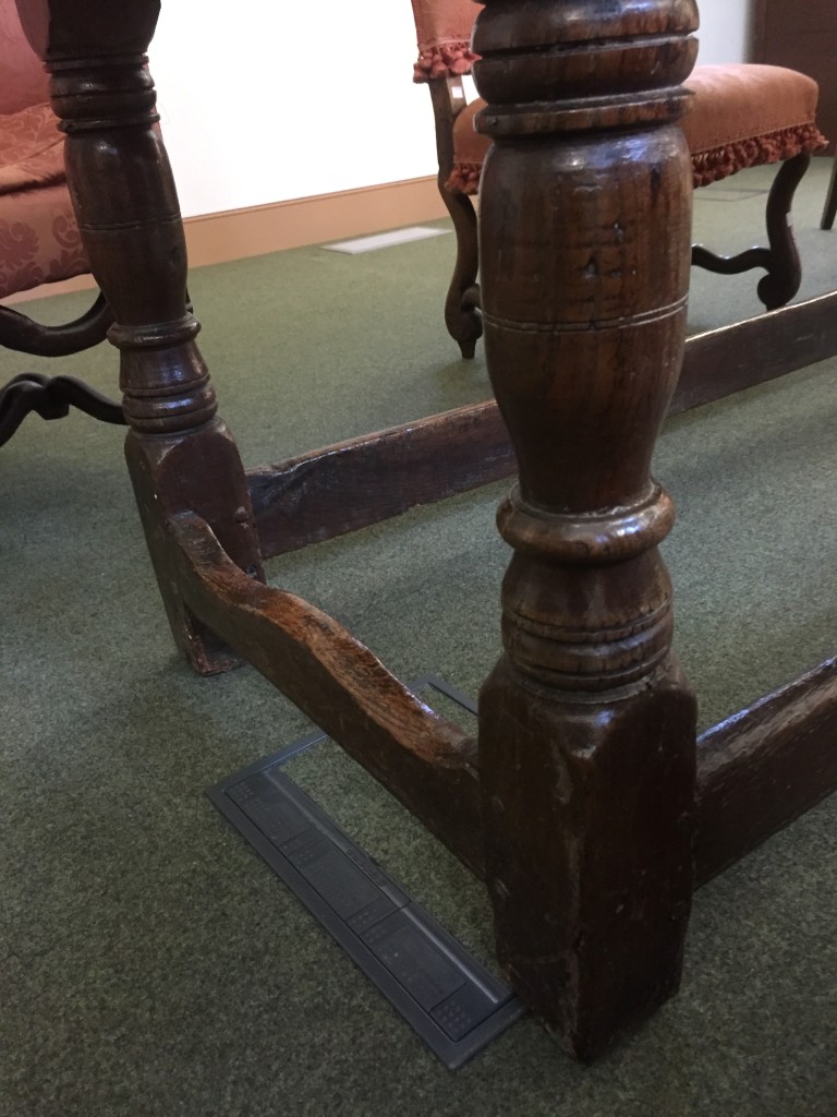 A 17th century oak refectory table, with a plank top on turned baluster column legs, united by - Image 2 of 4