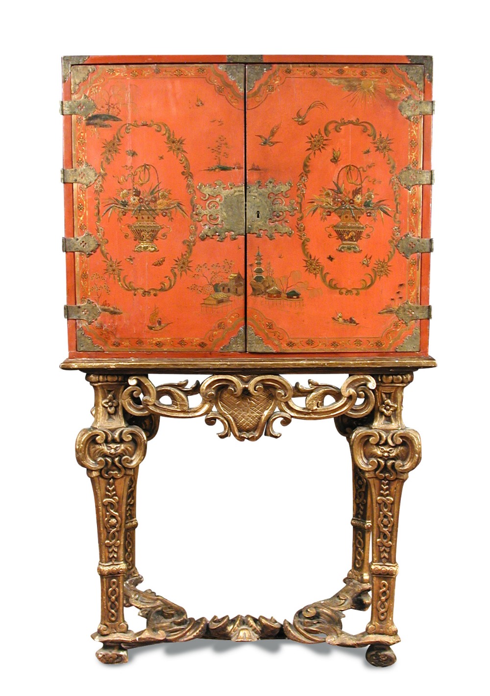 An 18th century Chinese red lacquer cabinet on a giltwood stand, decorated with a traditional