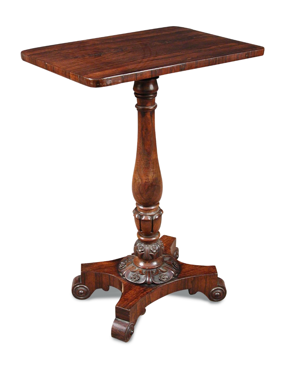A late Regency rosewood pedestal table, the baluster turned column with carved lapit and foliate