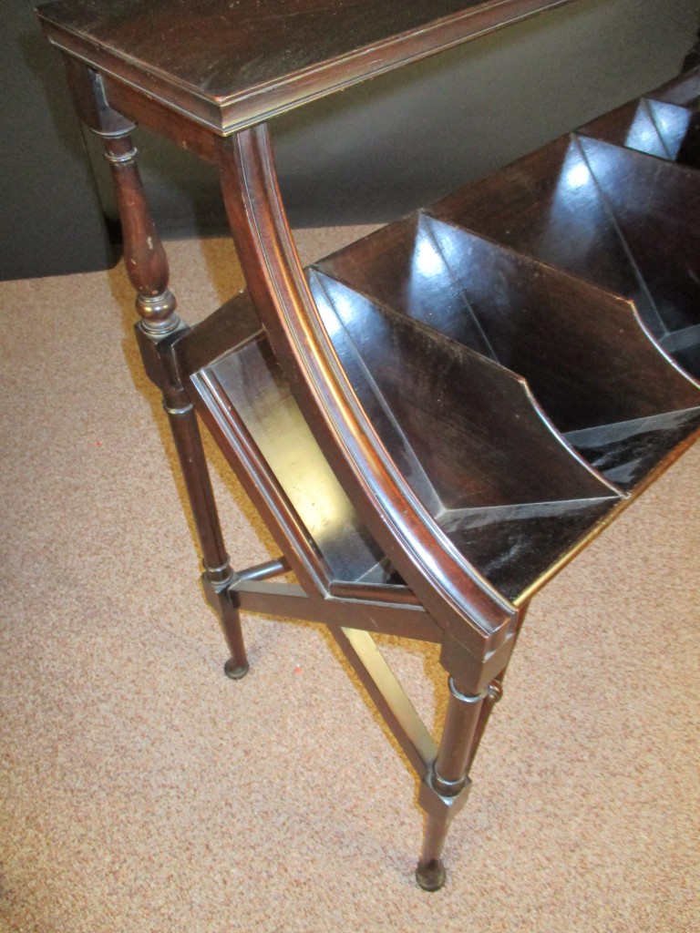 An Edwardian mahogany book stand, with five divisions and raised shelf, on column legs and pad - Image 2 of 3