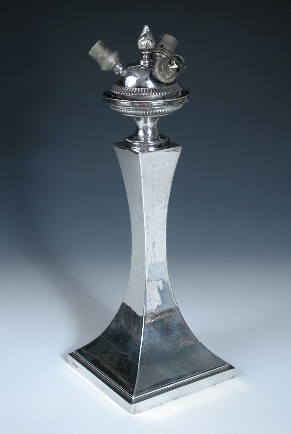 An Edwardian silver table lamp, by Hawkesworth, Eyre & Co, Sheffield 1906, raised on a plain