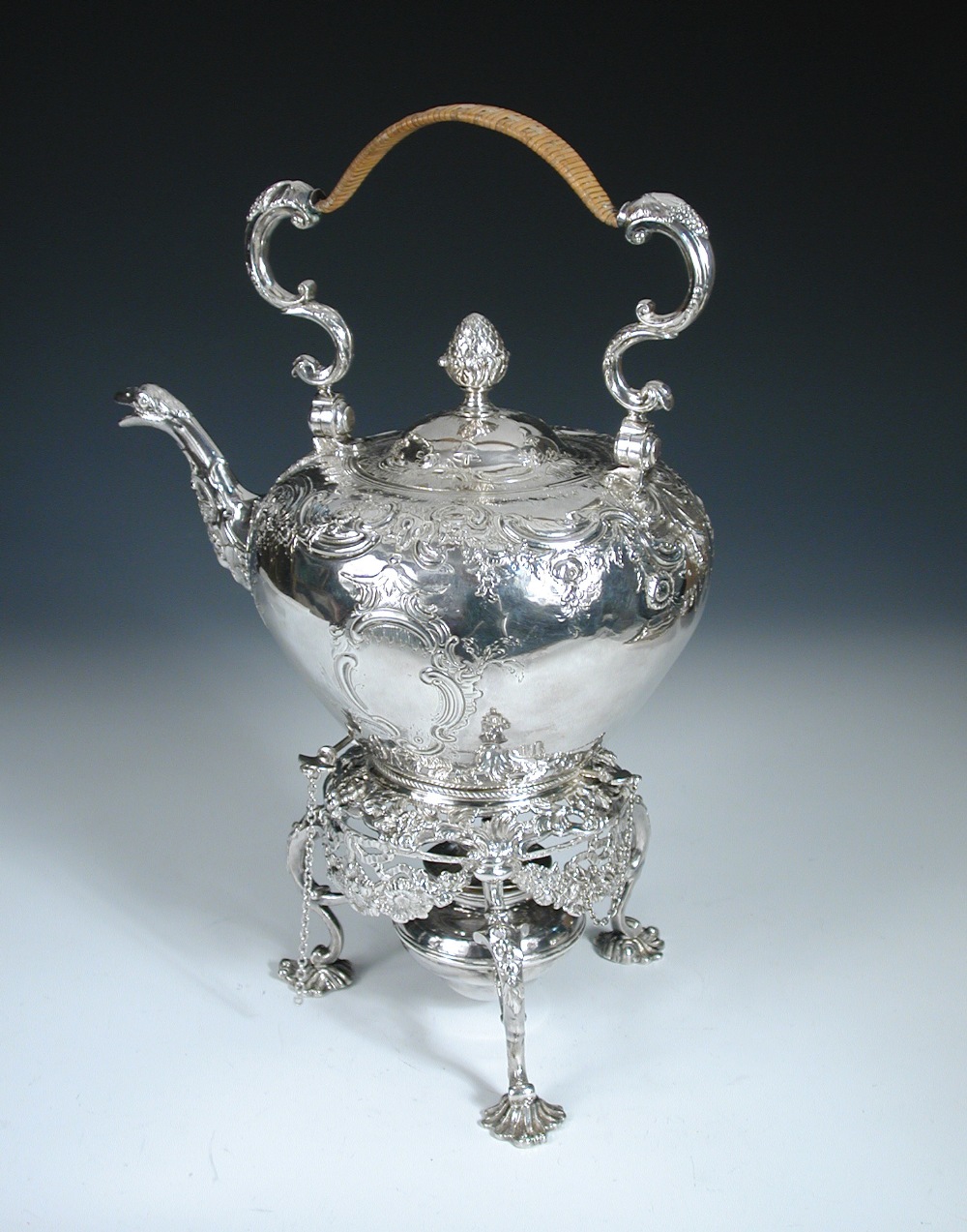 A large George II silver tea kettle on stand, maker's mark IC, possibly for J. Collins, London,