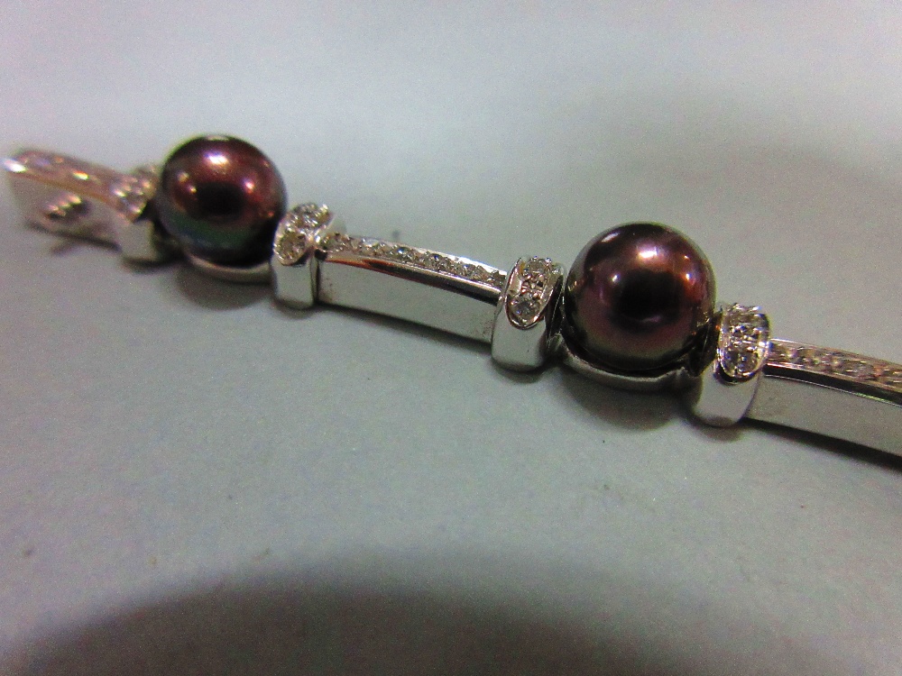 A black pearl and diamond bracelet and earring suite set in 18ct white gold, the bracelet designed - Image 2 of 5