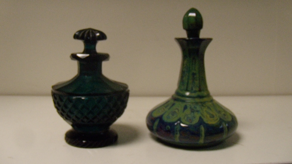 A 19th century Bohemian green lithyalin scent bottle and stopper together with a green glass scent