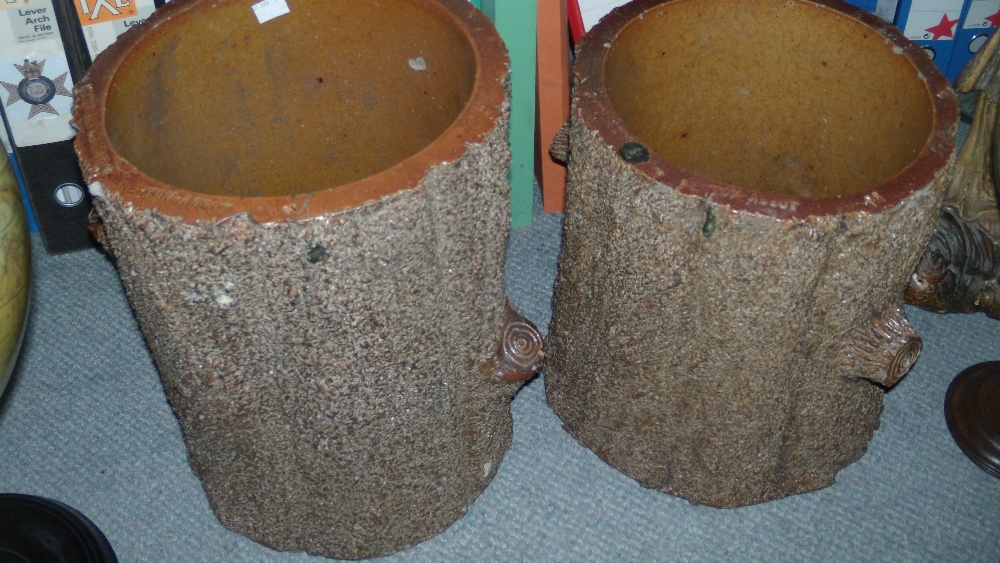 A pair of early 20th century Hexter Humpherson and Co. Newton Abbot brown salt glaze planters,