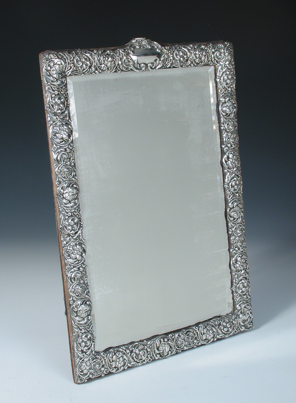 An Edwardian silver mounted dressing table mirror, by H Matthews, Birmingham 1903, rectangular,