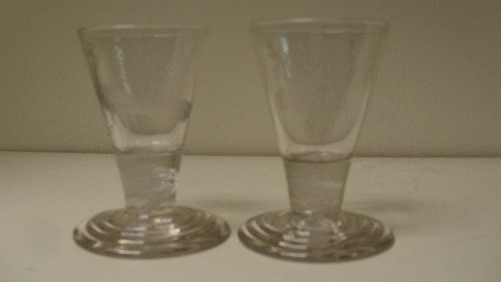 A pair of early 19th century firing glasses, the conical bowls engraved with stags' heads and - Image 2 of 2