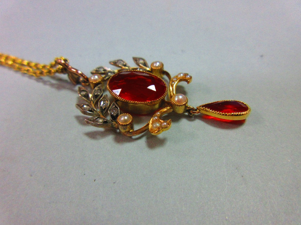 A belle époque fire opal, diamond and seed pearl pendant with chain, the oval cut fire opal collet - Image 2 of 4