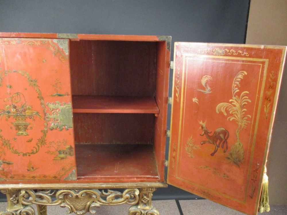 An 18th century Chinese red lacquer cabinet on a giltwood stand, decorated with a traditional - Image 4 of 9