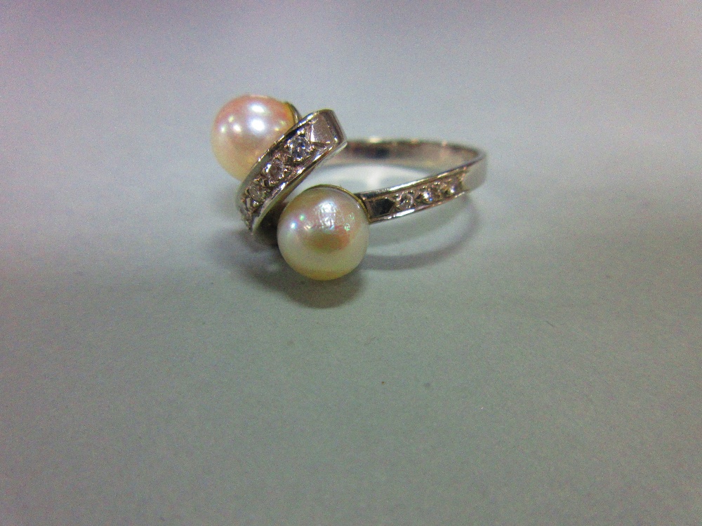 A Continental white gold, pearl and diamond crossover ring, the plain shank set to the front with - Image 2 of 5