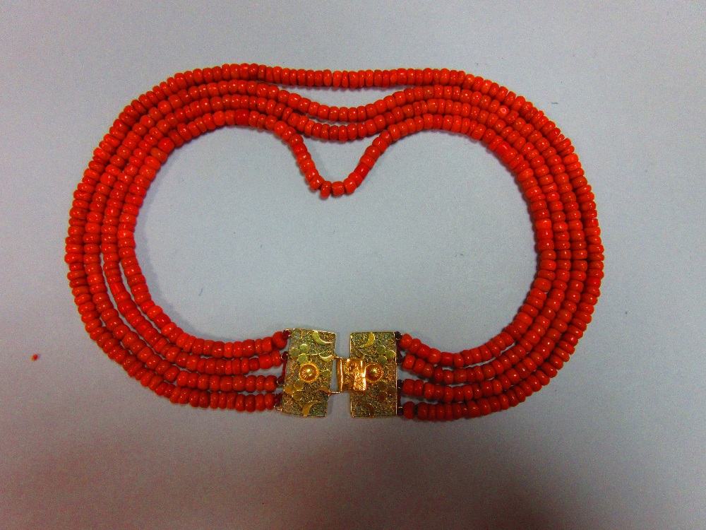 A period four strand Dutch coral necklace, each strand of approximately uniform tyre shaped beads,