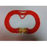 A period four strand Dutch coral necklace, each strand of approximately uniform tyre shaped beads,