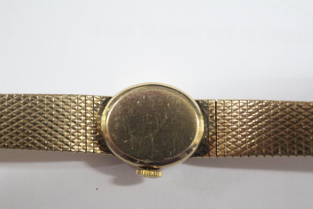 By Longines - a lady's 9ct gold cased wristwatch, the oval gold coloured dial with baton numerals, - Image 3 of 12