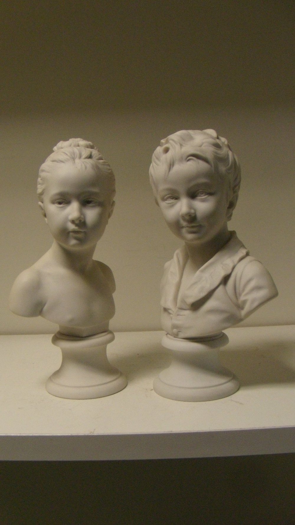 After Houdon, two 1920's Sevres biscuit busts of Alexandre and Louise Brongniart, the daughter of