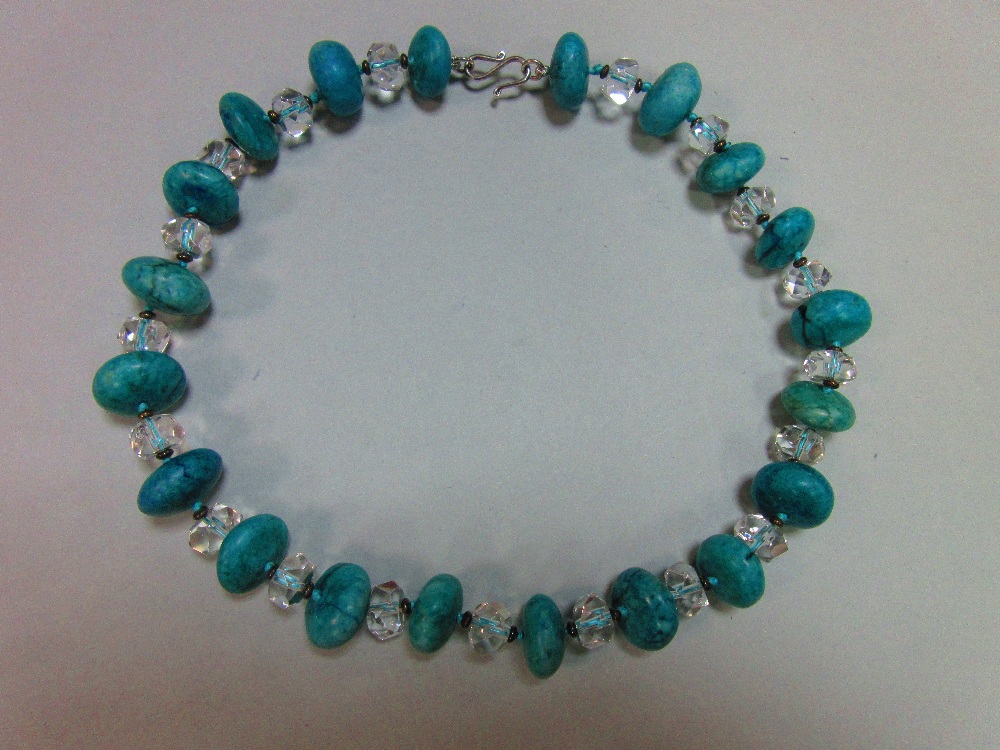 A rock crytal and turquoise howlite bead necklace, the faceted rock crystal beads alternating with