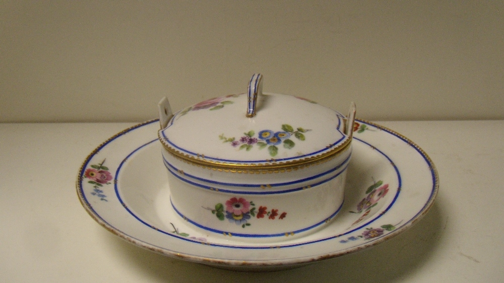 A Sevres butter dish and cover, date letter for 1753, painted by Jean Baptiste Tandart with