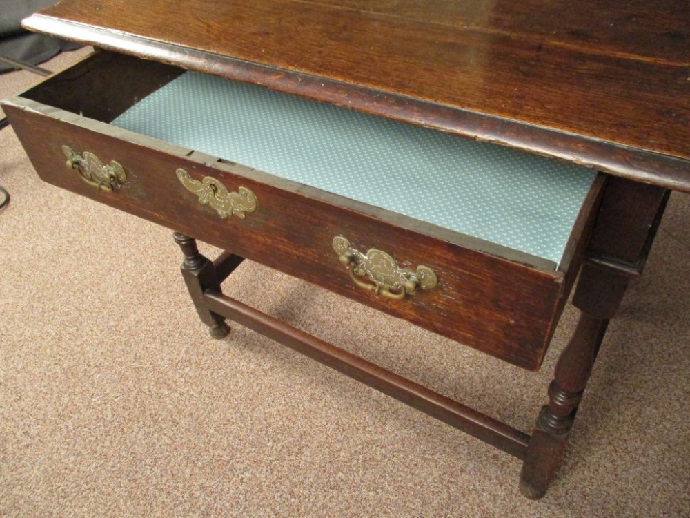 An early 18th century oak side table, with single drawer, engraved brass lock plate and handles on - Image 3 of 4