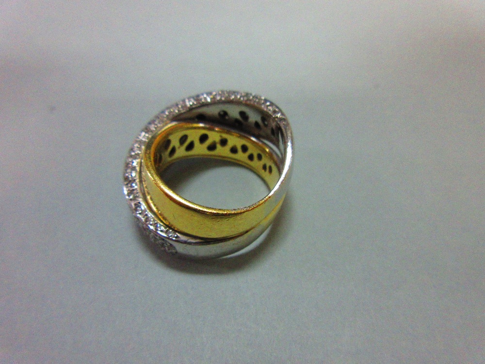 A modern diamond crossover band ring, of precious metal stamped '750' and designed as a plain - Image 3 of 6