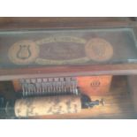 The Cabinet Roller Organ' by 'Autophone, Ithaca, NY' and seventeen wooden cylinders, the rectangular