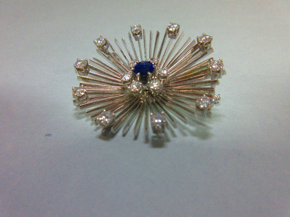 A mid 20th century diamond and sapphire flower brooch, formed by a central round cut sapphire in a - Image 2 of 4