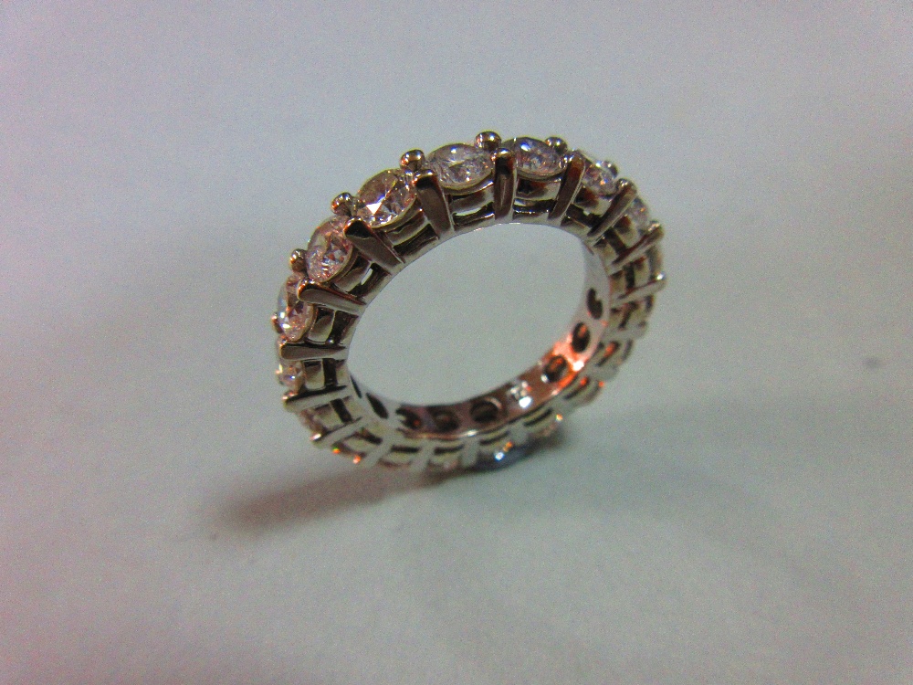 A diamond full hoop eternity ring, set with eighteen round brilliant cut diamonds in white - Image 2 of 5