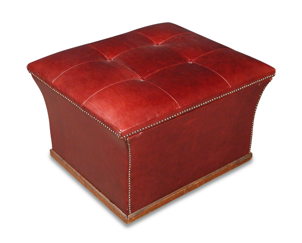 A red leather and brass studded ottoman stool, buttoned seat, on wheel casters 46 x 73 x 63cm (18