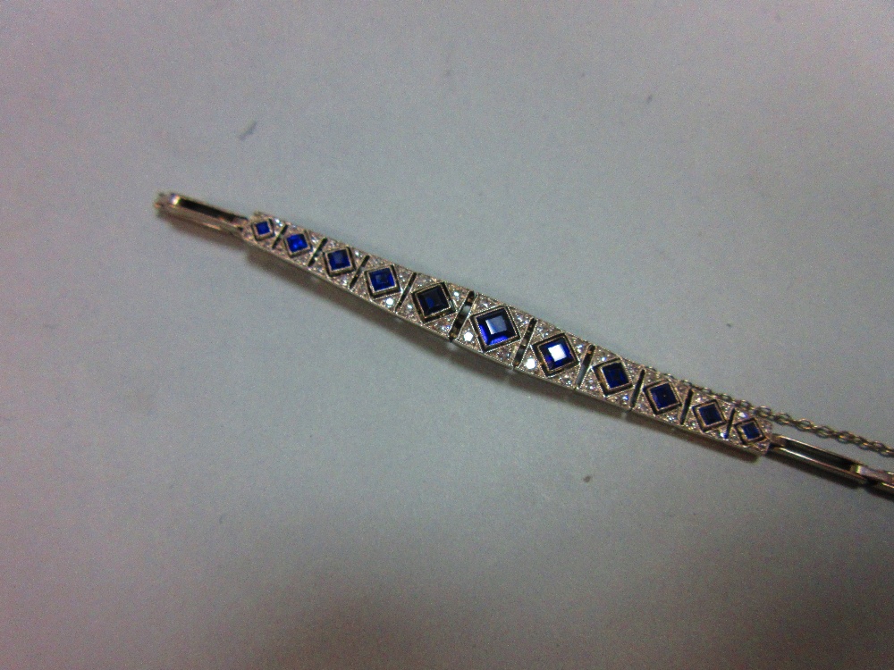 An Art Deco sapphire and diamond bracelet, set to the centre with an articulated and graduated