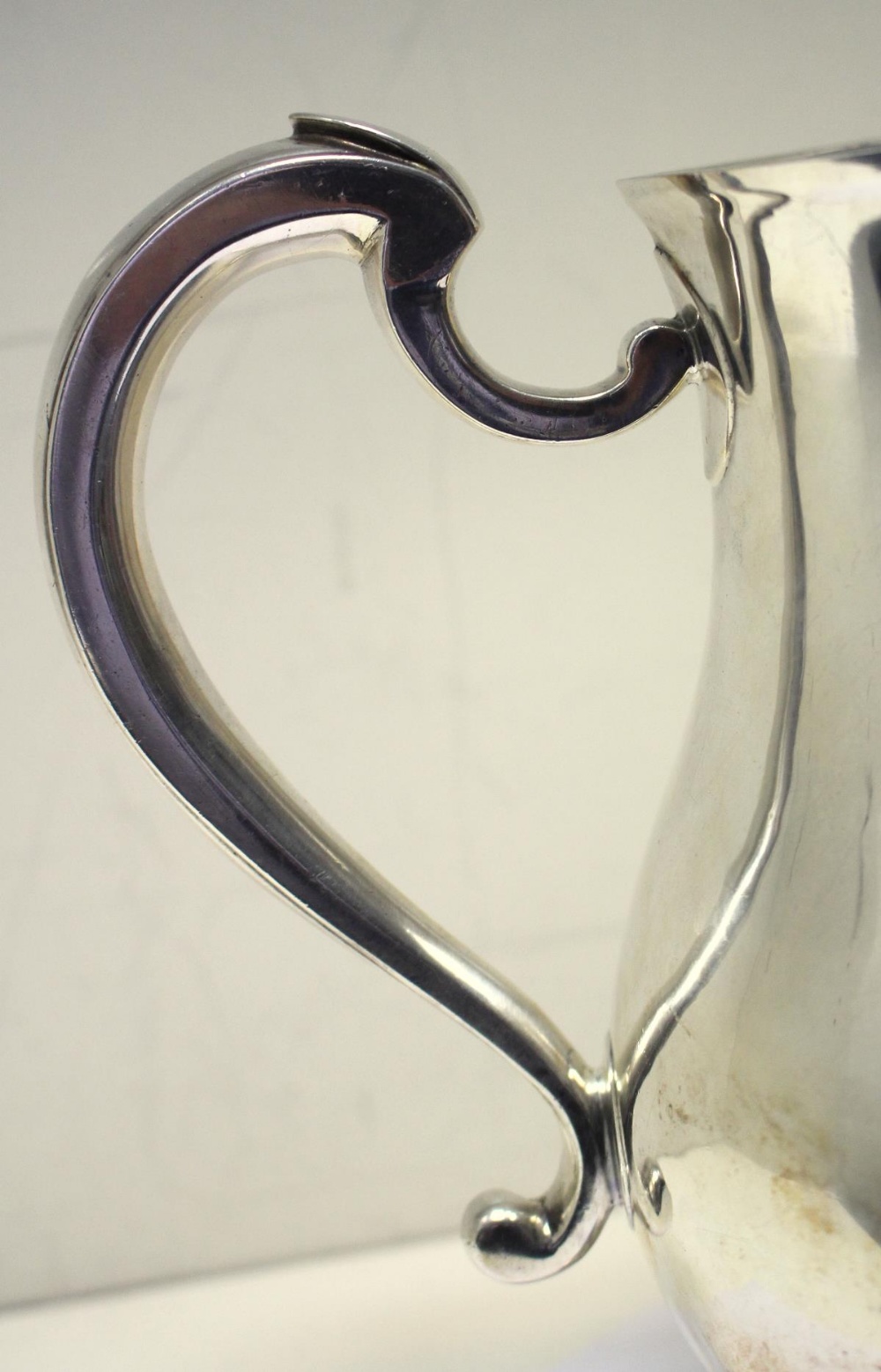A George II silver ale jug, by Jonathan Fossy, London 1742, of plain baluster form over a - Image 5 of 5