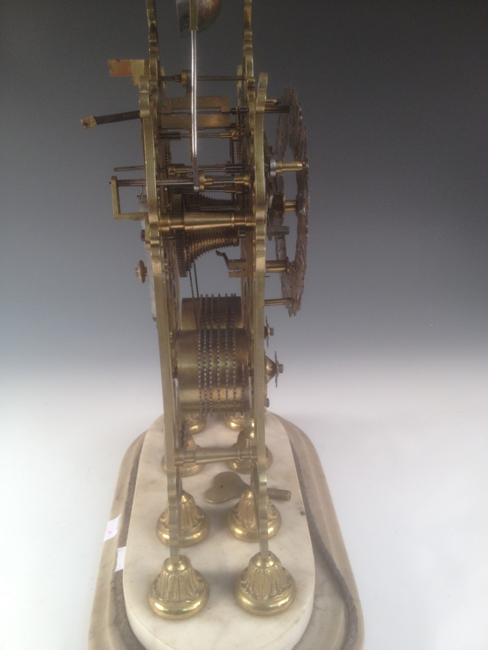 A Victorian brass skeleton clock, the spire top case with bell above pierced silvered chapter ring - Image 5 of 5