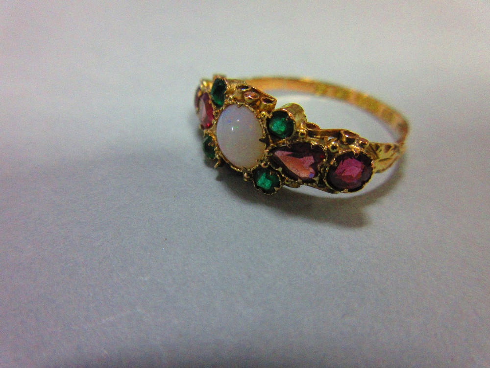 A Victorian opal and gemset ring in 15ct gold, the round cabochon opal between heart cut and round - Image 2 of 5