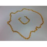 An 18ct gold necklace and bracelet suite, the fancy link chains with Continental assay marks,