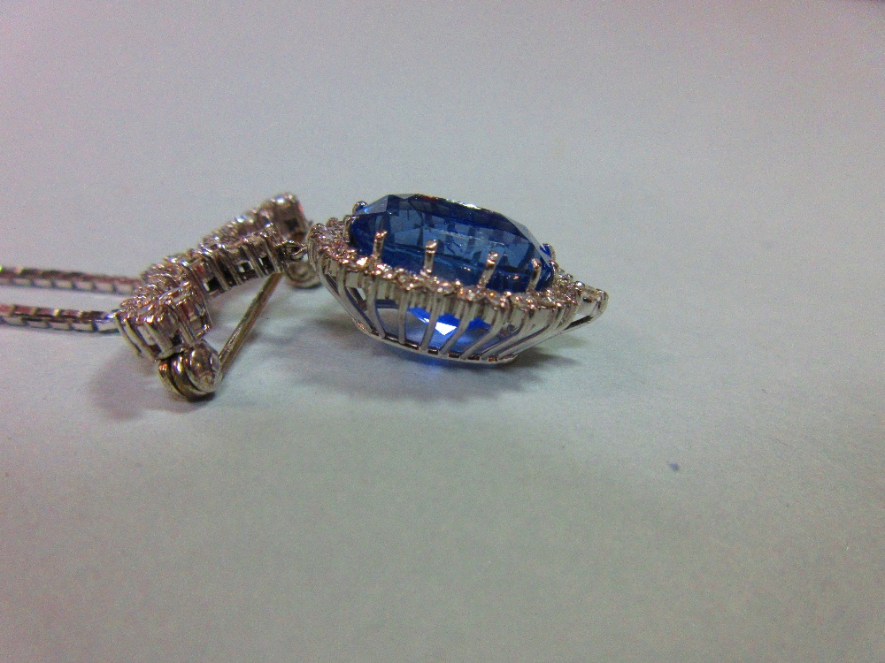 A sapphire and diamond pendant / brooch with white gold chain, the jewel designed as a large oval - Image 2 of 5