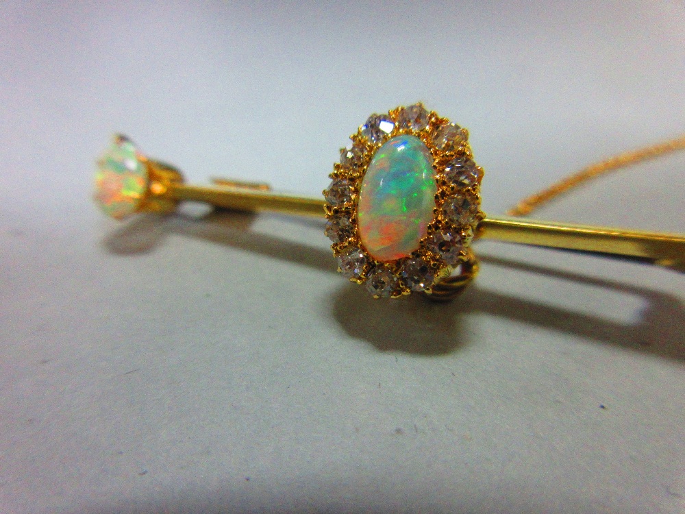 An opal and diamond bar brooch, the knife edge bar set to the centre with an oval cabochon opal in a - Image 5 of 5