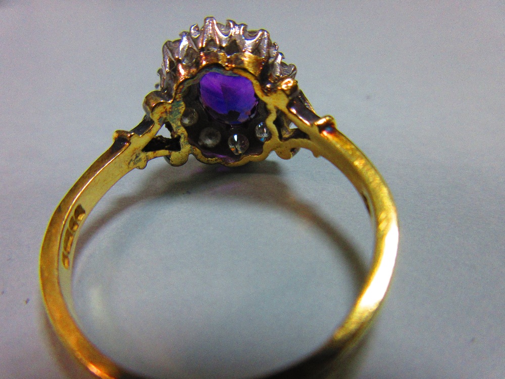 An amethyst and diamond cluster ring, the oval mixed cut rich purple amethyst claw set in a border - Image 4 of 8