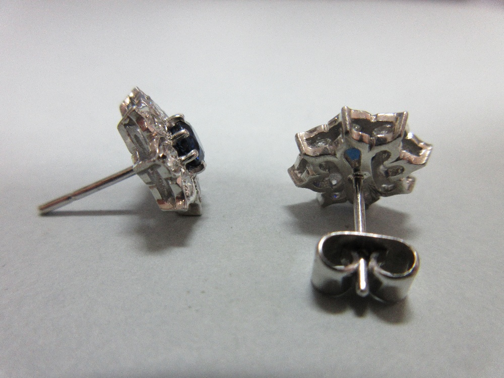 A pair of sapphire and diamond cluster earstuds, each designed as a flowerhead with a round cut - Image 3 of 4