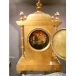 A late Victorian Aesthetic movement clock garniture, the lacquered brass case with domed cresting
