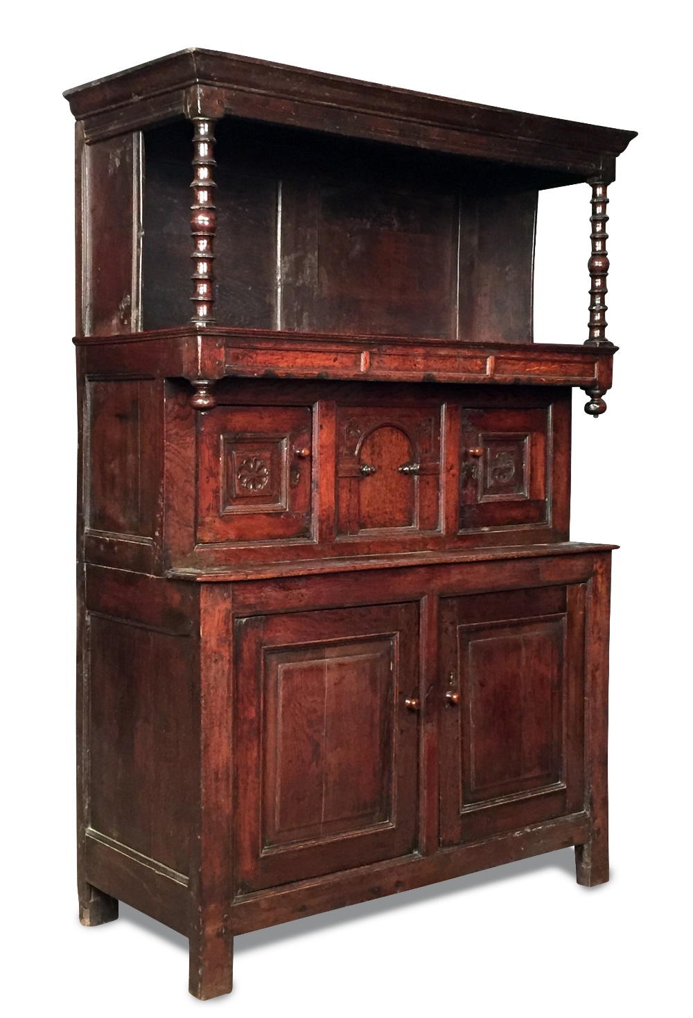 A late 17th century oak tridarn, with open front overhung shelf to the top supported by turned