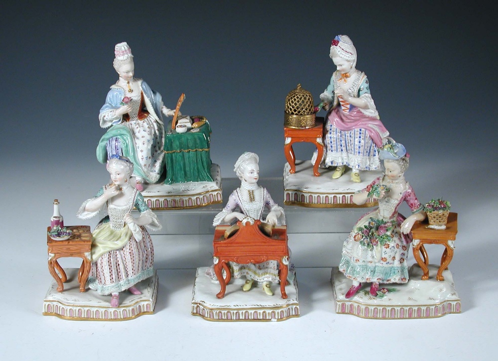 A set of five Meissen ladies seated stimulating their senses, one smelling a rose taken from the