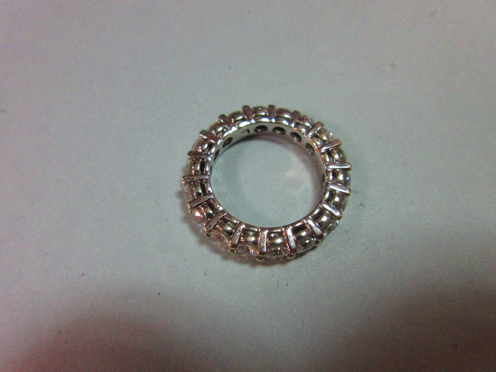 A diamond full hoop eternity ring, set with eighteen round brilliant cut diamonds in white - Image 5 of 5