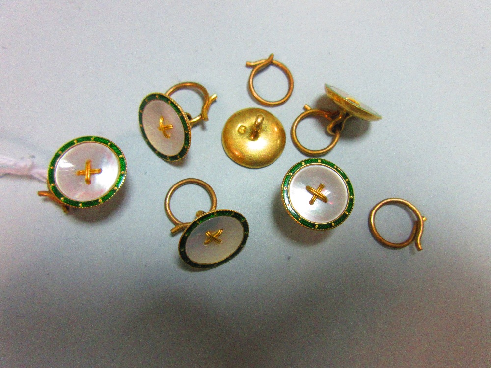 A set of six enamel and mother of pearl dress buttons, each of circular form with a rim of green