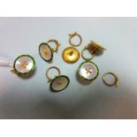A set of six enamel and mother of pearl dress buttons, each of circular form with a rim of green