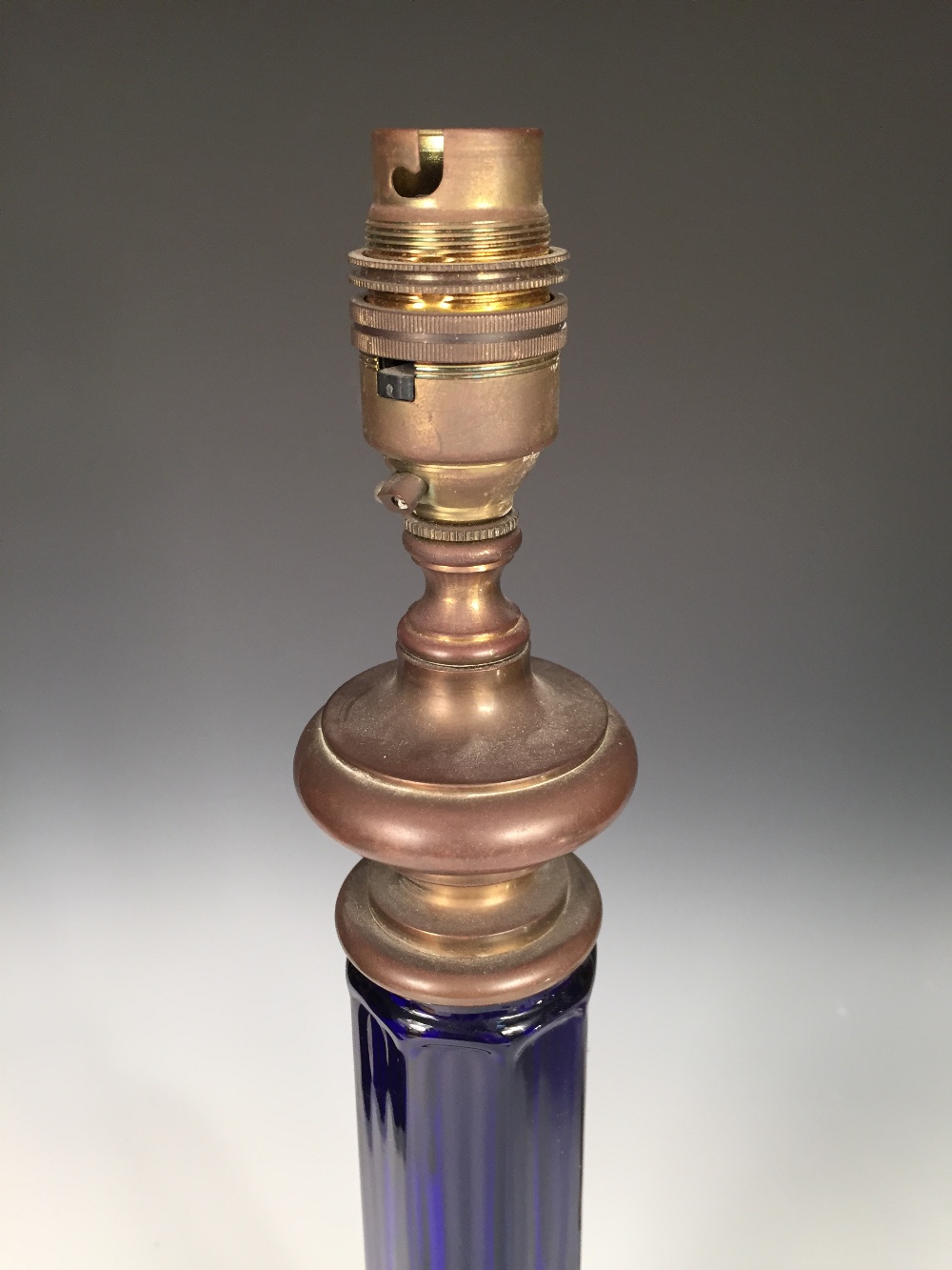 A Victorian blue glass table lamp, the octagonal column above a broad base and brass mounts, - Image 3 of 3