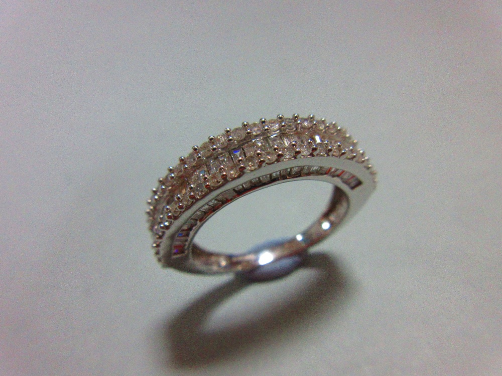 A white gold and diamond half hoop ring, with a channel set line of baguette cut diamonds between - Image 2 of 6