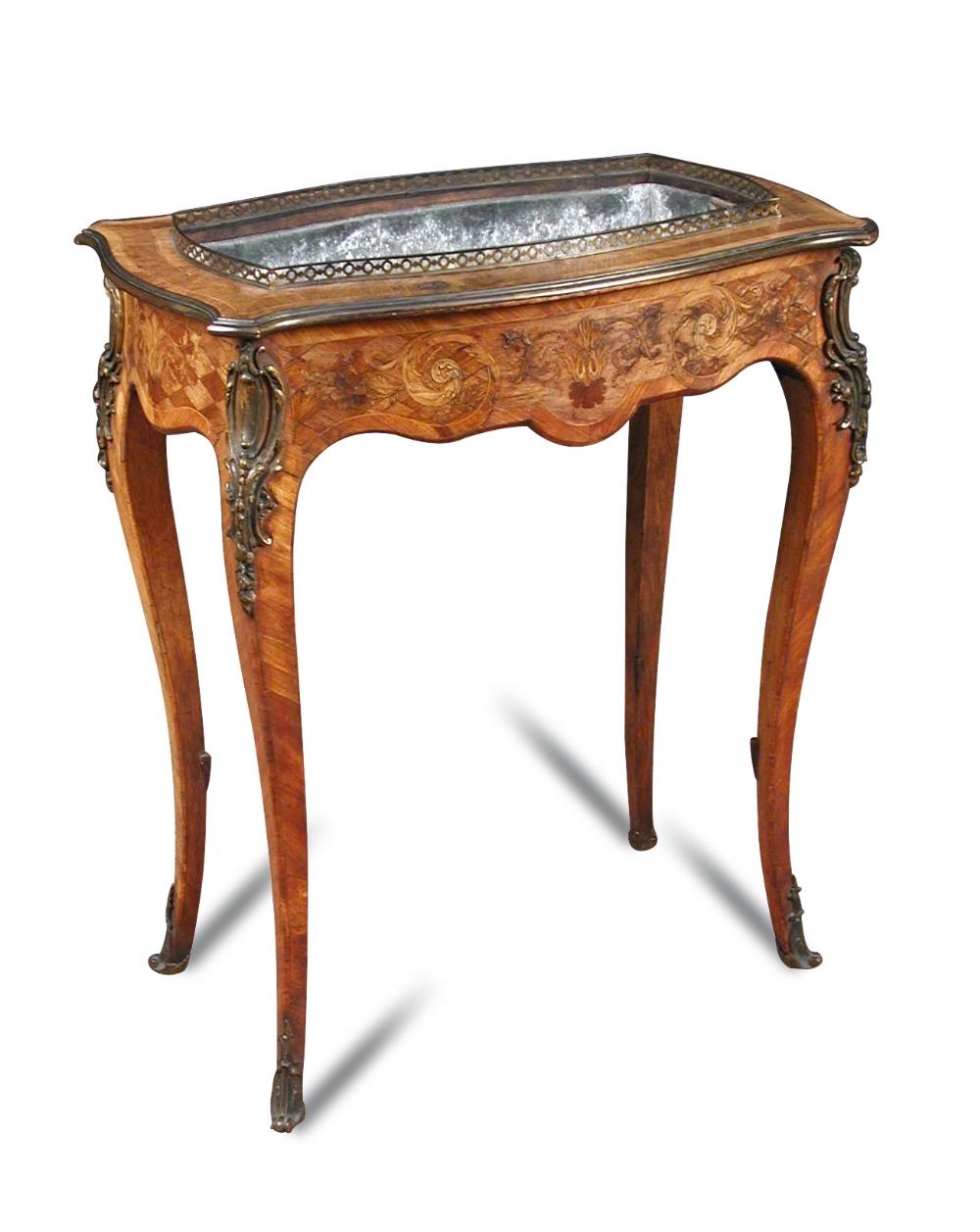 A Louis XV style jardiniere, bearing Edwards & Roberts retail label, marquetry inlaid with brass