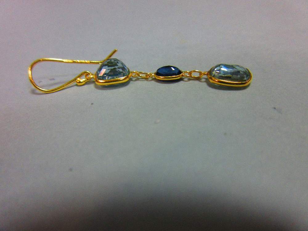 A pair of aquamarine and sapphire earrings, each gold wire hook suspending an articulated line of - Image 4 of 4