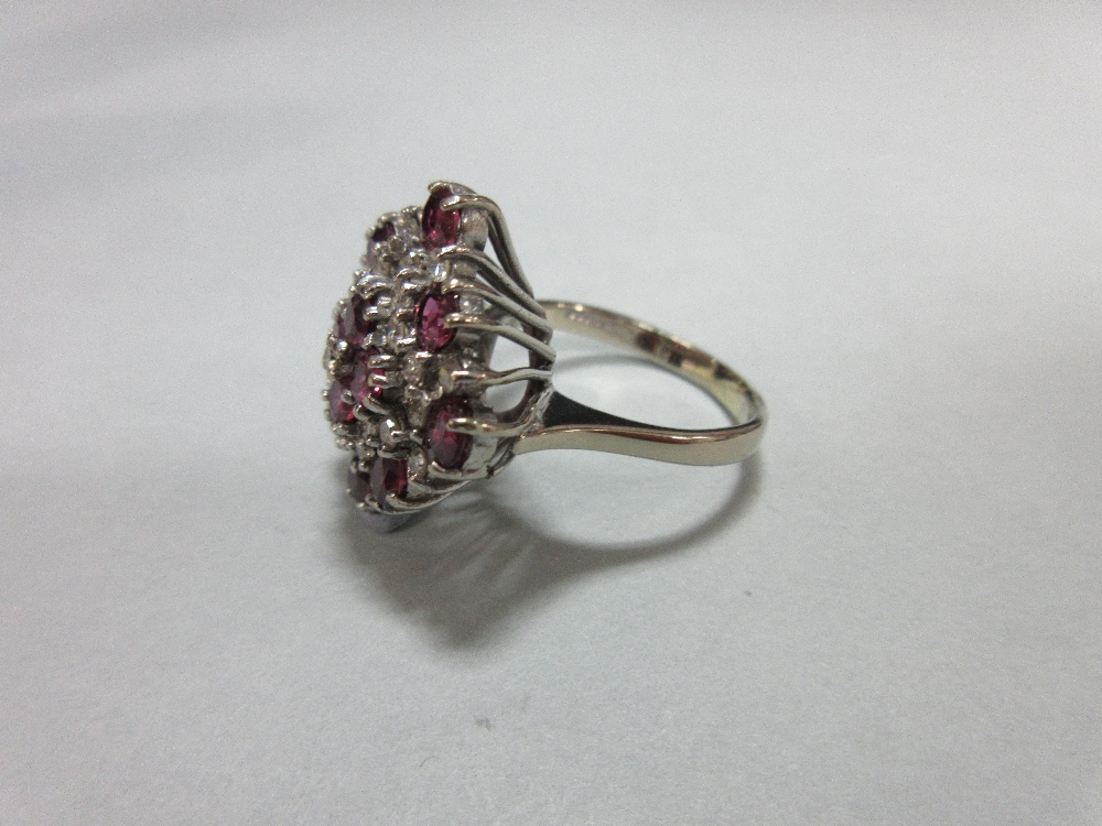 A ruby and diamond cluster ring in 18ct white gold, designed as a densely set diaper with a - Image 4 of 6