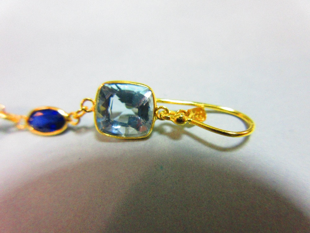 A pair of aquamarine and sapphire earrings, each gold wire hook suspending an articulated line of - Image 3 of 4