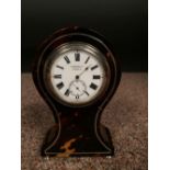 An Edwardian small size tortoiseshell mantle clock, the balloon shape case with 4.5cm (2in) enamel