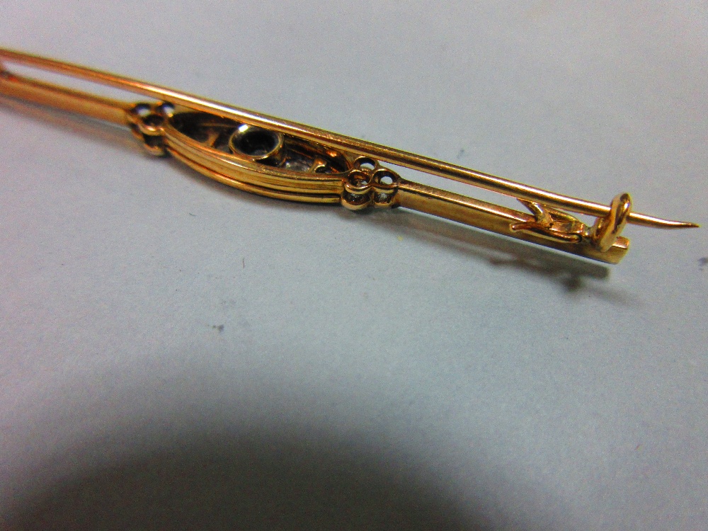 A diamond and enamel bar brooch, set to the centre with a graduated line of five old round brilliant - Image 3 of 4